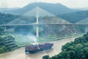 Cargo ship and Centerary Bridge on Panama Canal